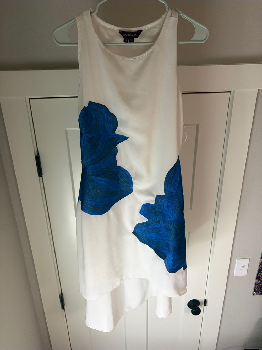 Ranna Gill White High-Low Dress with Bold Blue Floral Accents